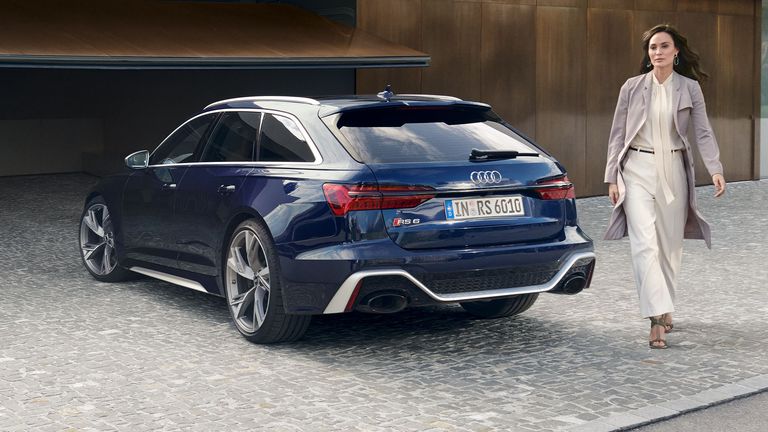 Audi RS 6 Avant side rear view with model on the side