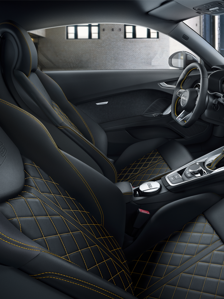 Interior of the TT Coupé with sports seats and contrast stitching in yellow